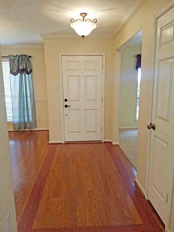 Entry with coat closet open to Formal Dining, Study and Den