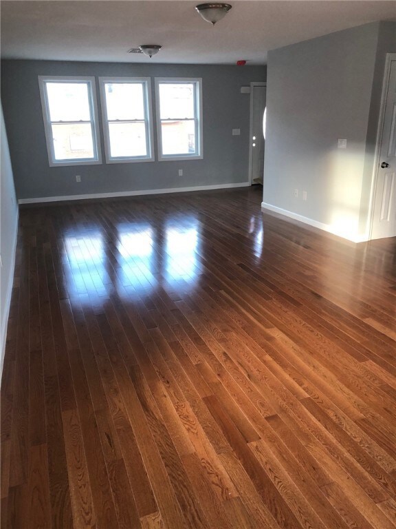 Living/Dining with Gleaming Hardwood Floors.