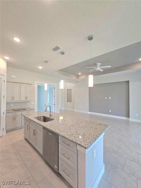 Kitchen featuring a sink, dishwasher, a center isl