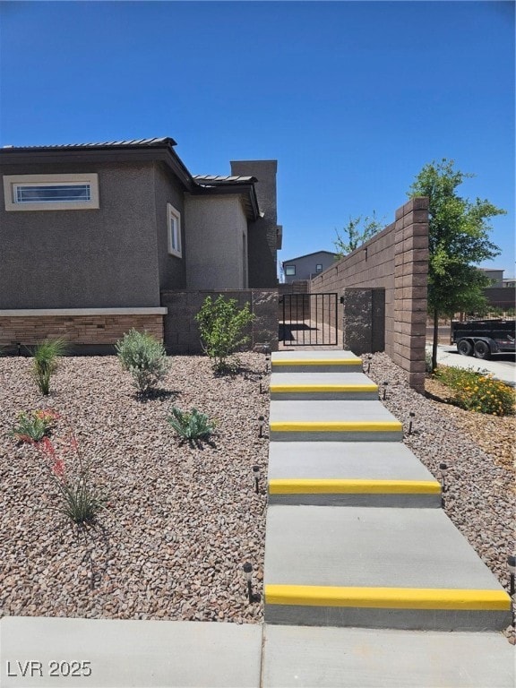 View of side of property featuring stucco siding a