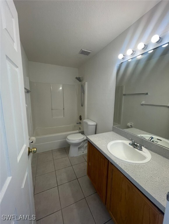 Bathroom featuring vanity, tile patterned floors,