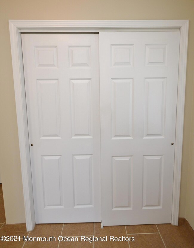 DOUBLE COAT CLOSET IN THE ENTRY FOYER