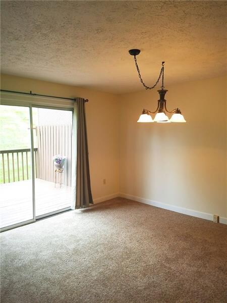 The dining area with a view of the outdoors and im