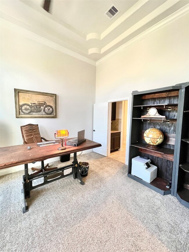 Built in Book Shelves, Tray Ceiling and Perfect access to the Coffee Bar