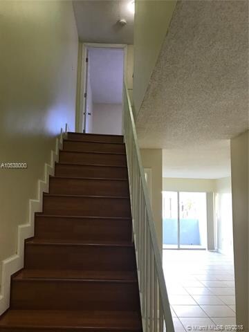 stairs up to the mater bedroom. To the immediate r