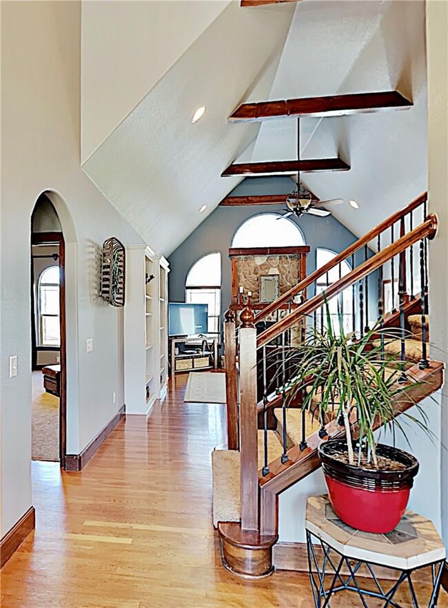 Soaring ceilings and custom woodwork as you enter