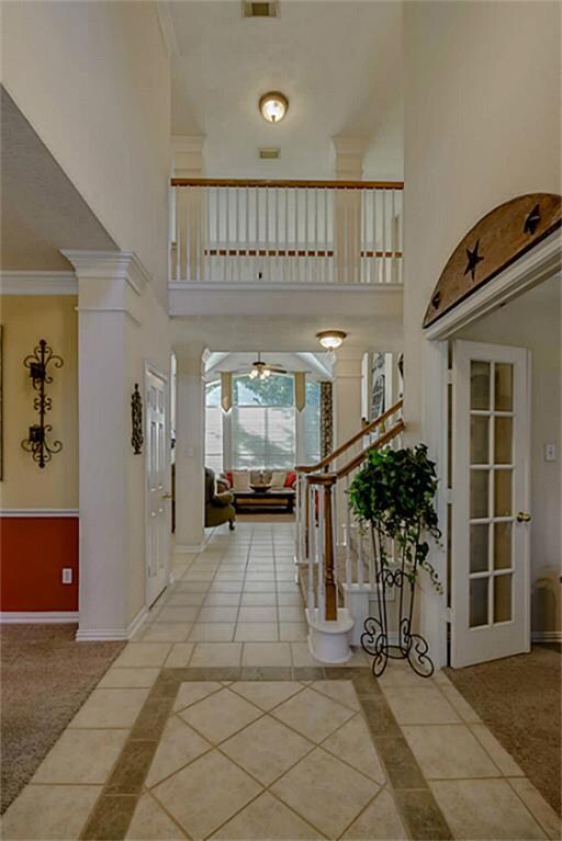 Guests are greeted with a two story entry that opens up to the living room