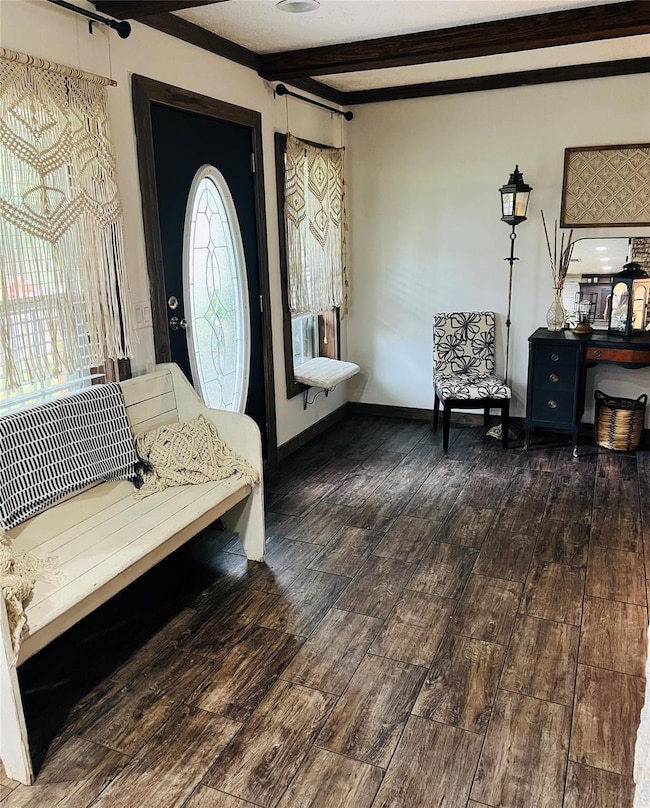 Foyer with an inviting chandelier, plenty of natur