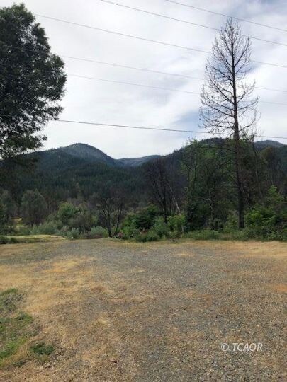 Driveway open area leading to pad