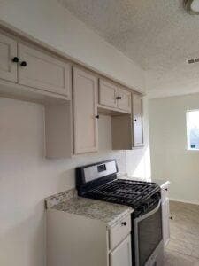 Kitchen featuring light stone countertops, a textu