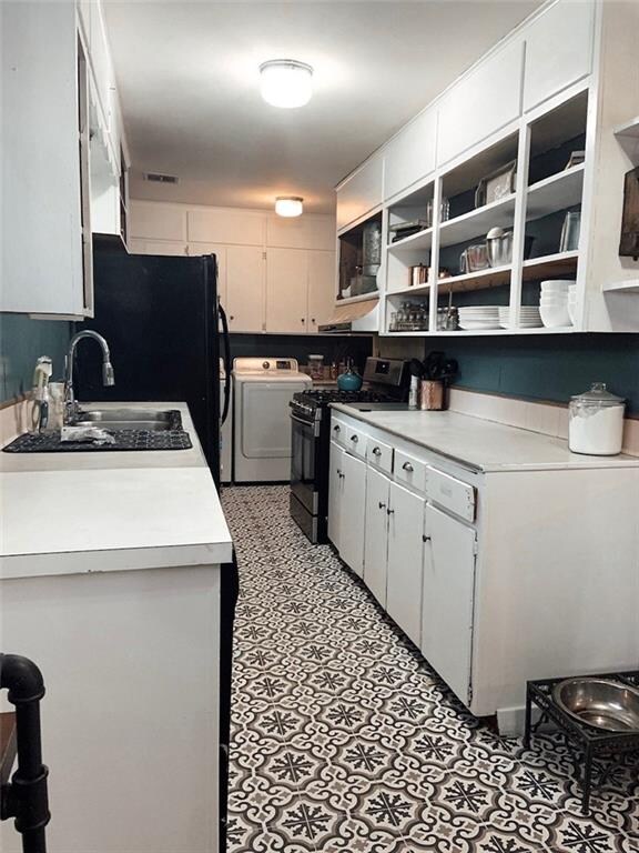 Open cabinetry and easy access to the laundry area