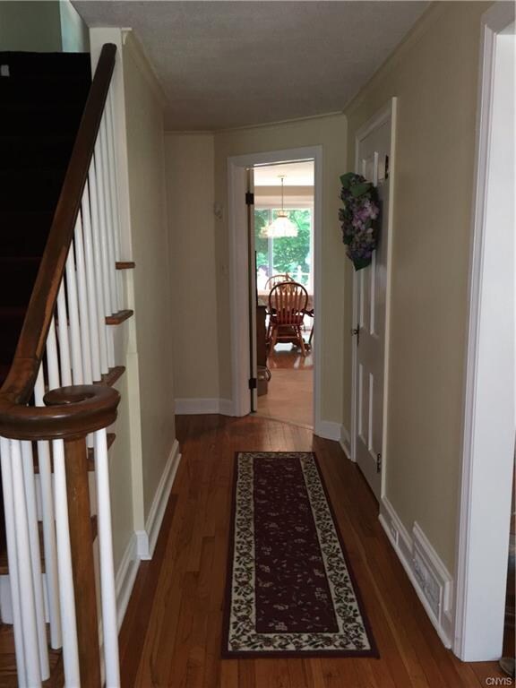 A wide foyer and stairwell at the entrance. Dining