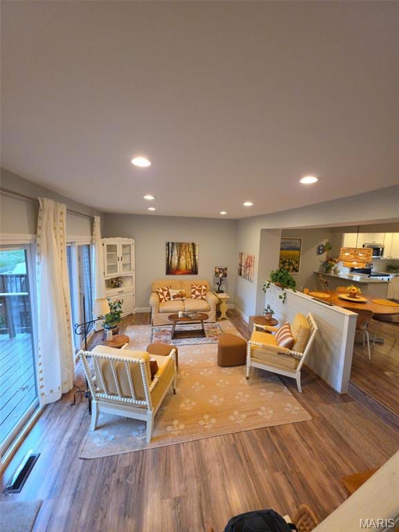 Living area featuring recessed lighting and wood finished floors