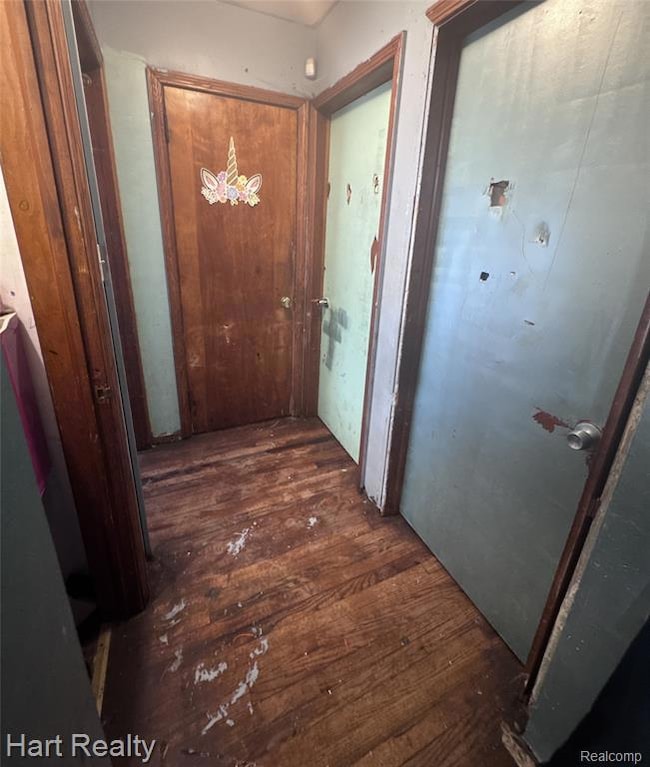 Corridor with dark wood finished floors