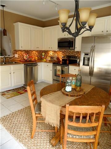 KITCHEN: Great size with breakfast area, stainless steel appiances, tile backsplash, upgraded lighting 