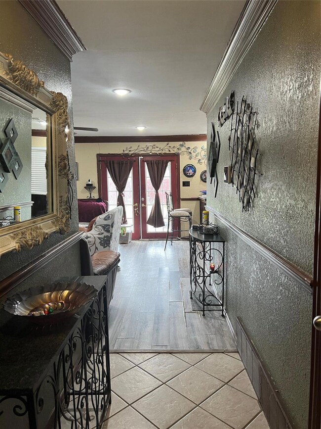 Hallway with light tile patterned floors, ornament