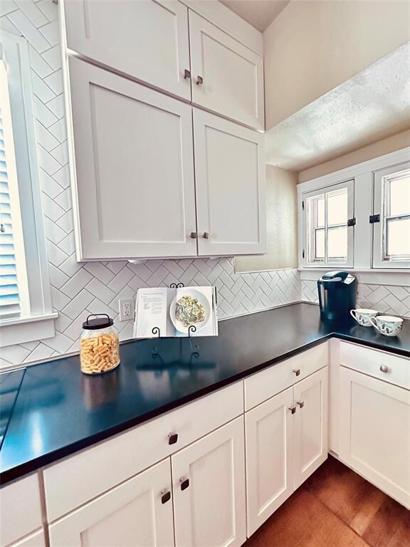 Newer cabinetry and natural stone countertops