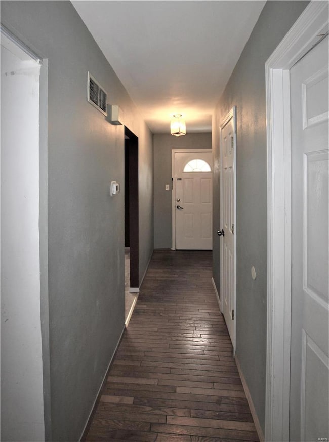 Front door and hall bath to Right, Hall way into f