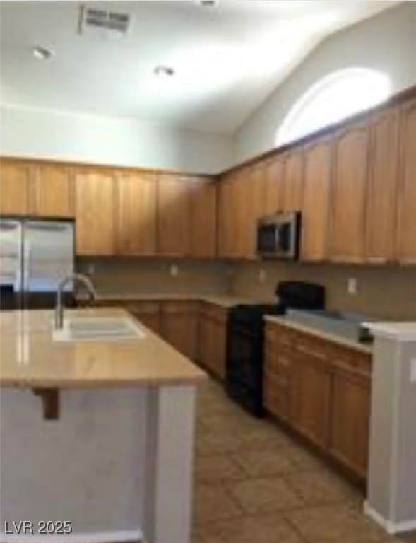 Kitchen with appliances with stainless steel finis