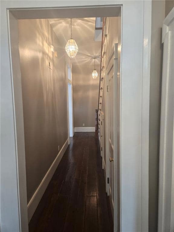 Unfurnished living room featuring hardwood / wood-