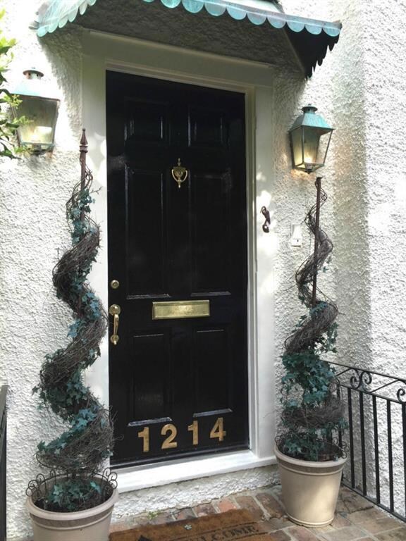 BEAUTIFUL HIGH GLOSS BLACK DOOR ADORNED WITH BRASS