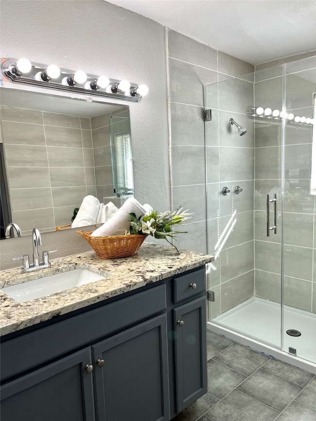 Large frameless shower in primary ensuite bathroom