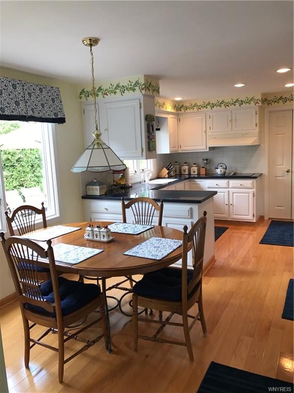 Gorgeous kitchen with hardwood and granite. The cu