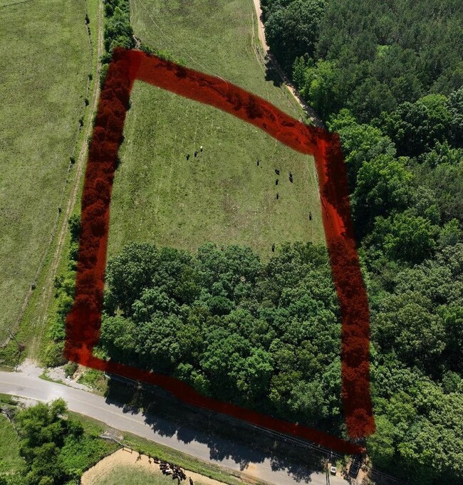 Birds eye view of property featuring a rural view