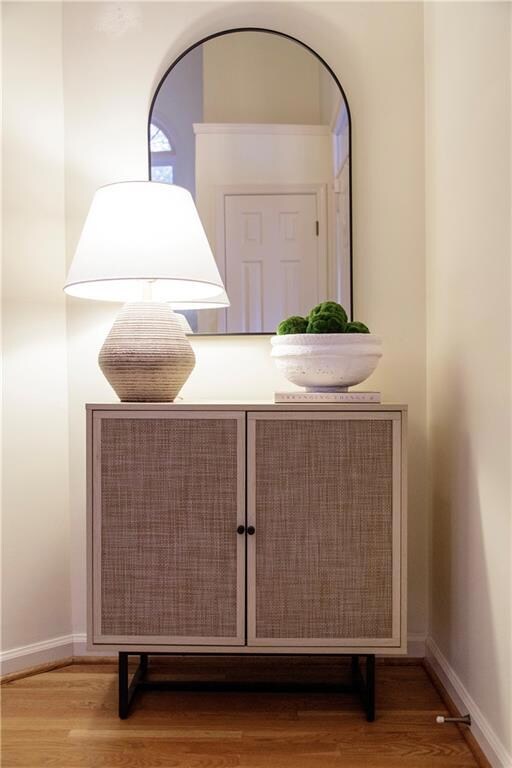 A cozy nook in the foyer offers a warm welcome wit