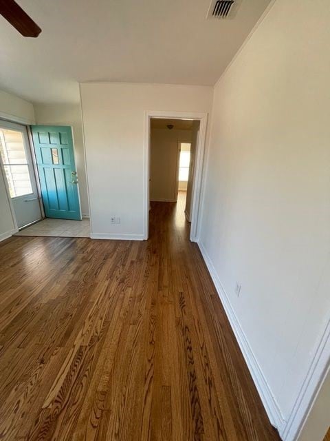 Empty room with dark wood-style floors