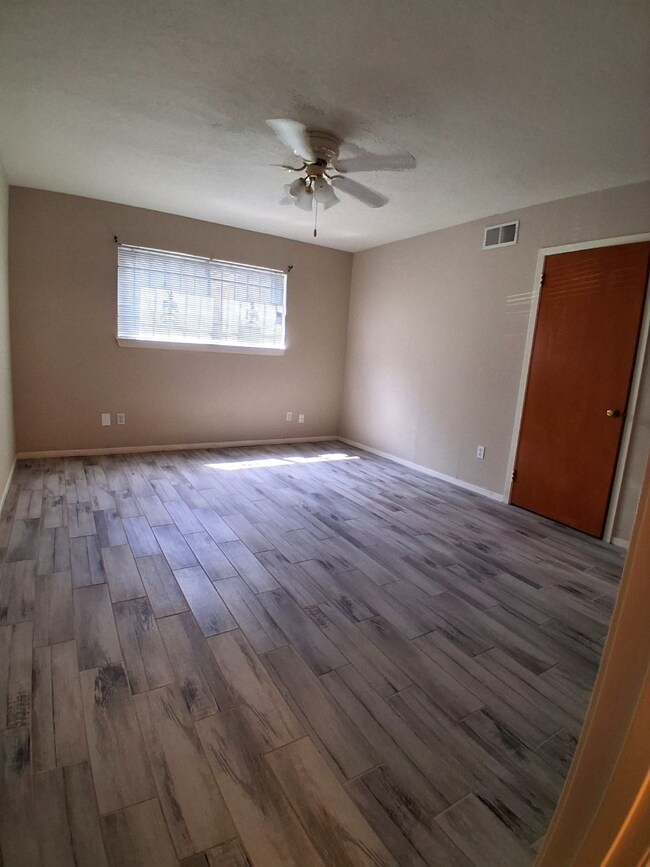 Primary Bedroom-updated flooring, ceiling fans