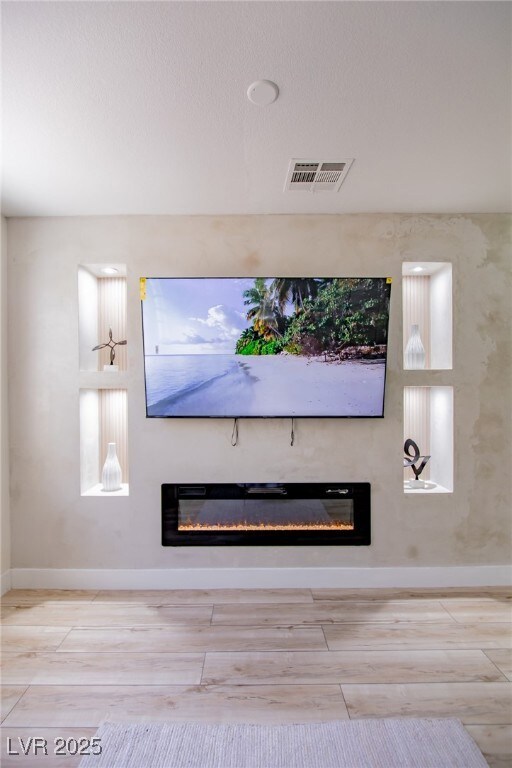 Details featuring visible vents, wood finish floor