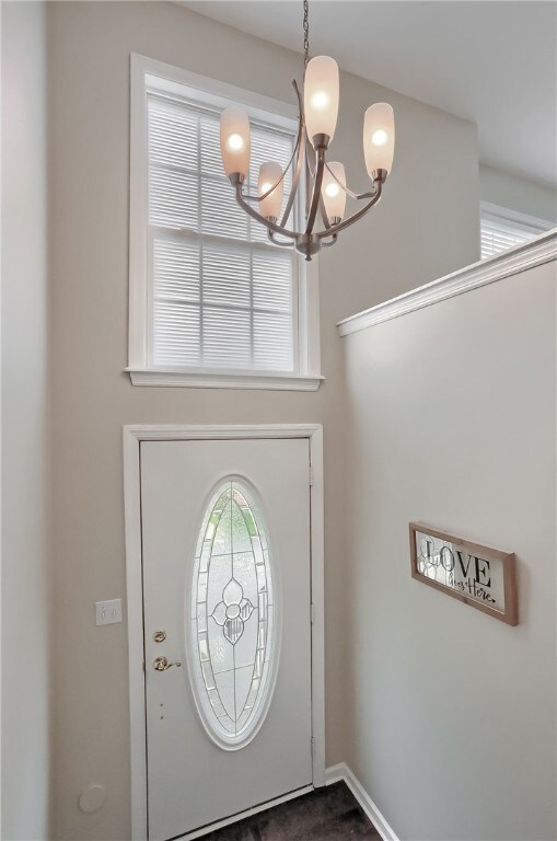 Two story entry with hard wood flooring