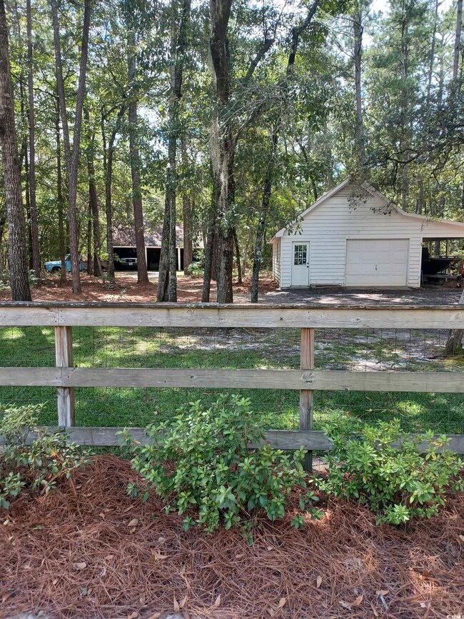 View of yard featuring a garage