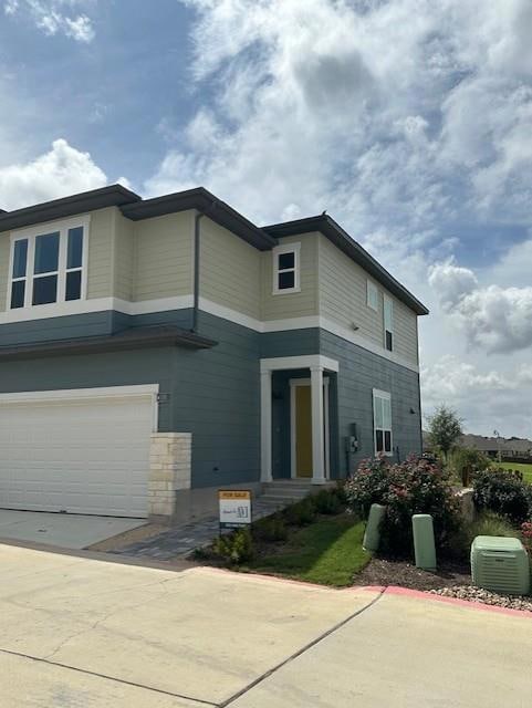 View of front facade with an attached garage and 