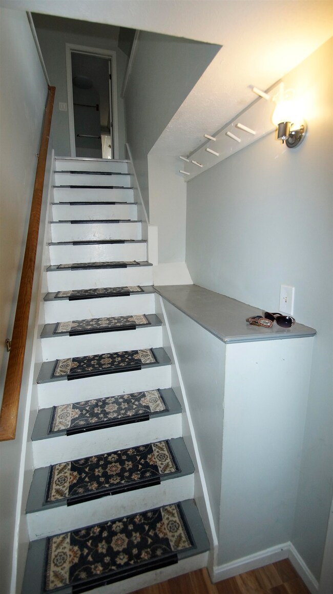 Inside unit entry with stairs up to the living room