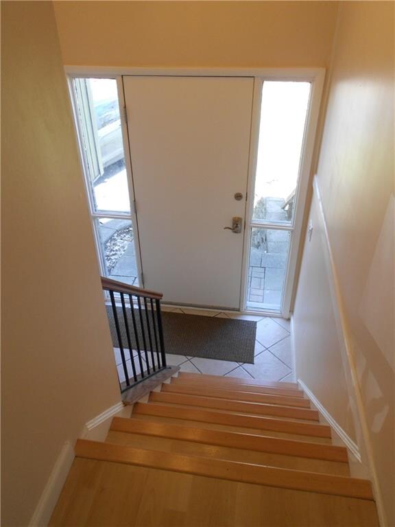 The tiled foyer introduces you to the upper level 