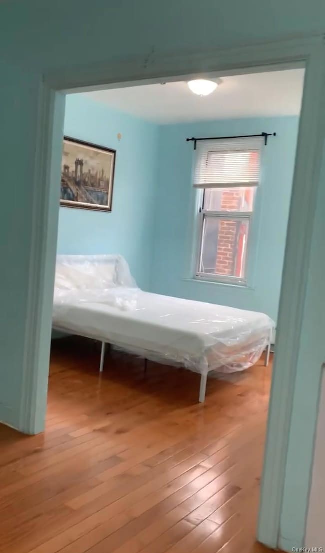 Bedroom featuring hardwood / wood-style floors