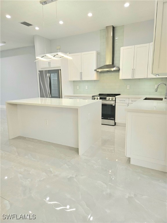 Kitchen with wall chimney range hood, stainless st