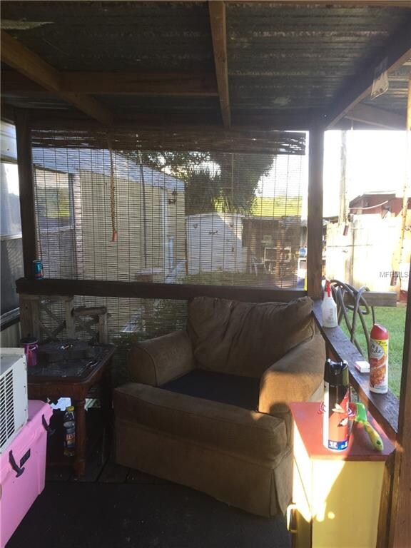 Porch entrance to sliding glass doors that access 