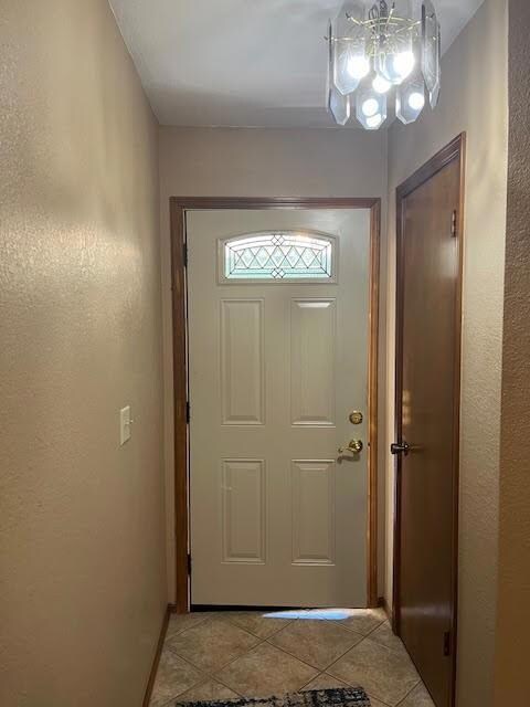 Entryway featuring light tile patterned flooring a