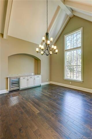 The formal dining room includes a soaring ceiling,