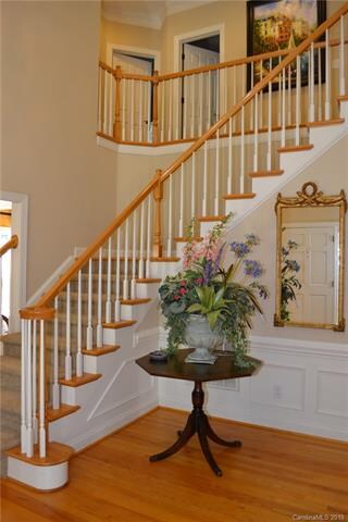 Beautiful Turned Stairway leads to Upper Level