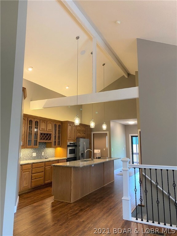 Stunning cathedral ceilings in kitchen are an impr