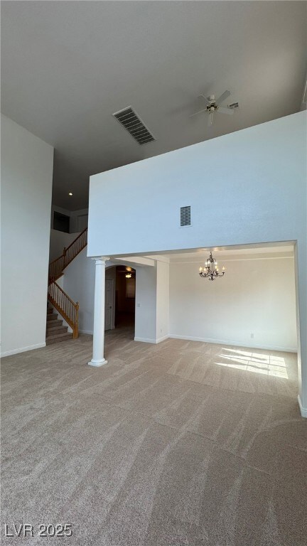 Unfurnished living room with a ceiling fan, light