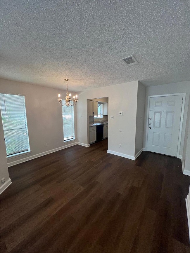 Unfurnished living room with a textured ceiling, 