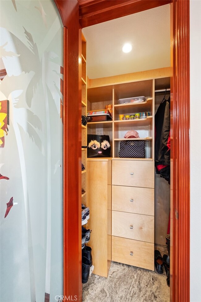 Custom closet by front entry way.