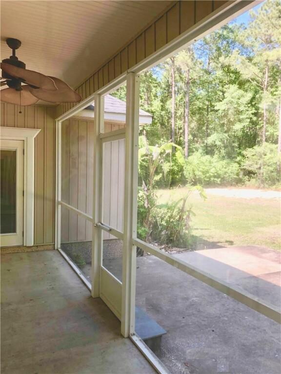 Screened porch overlooking backyard- both master s