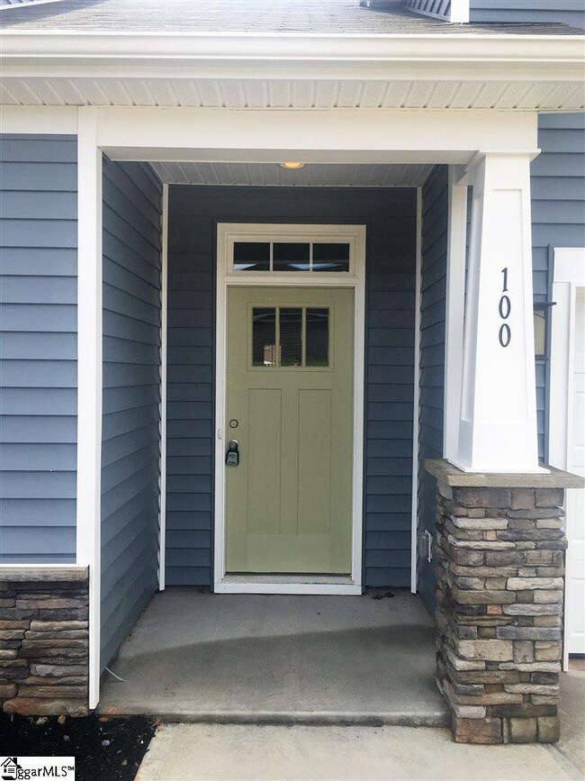 Covered stoop with natural stone accent