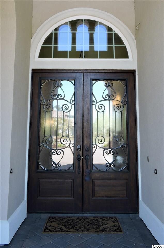 Mahogany Front Door with Clear Glass and Iron Desi